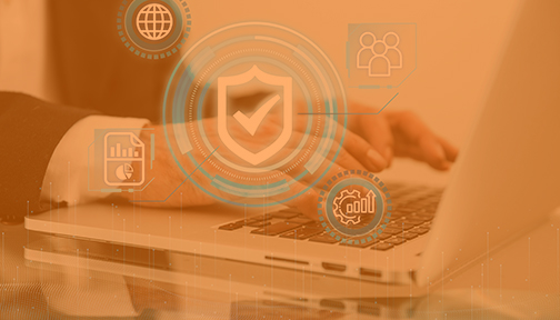 Data protection icons and a person typing on a laptop